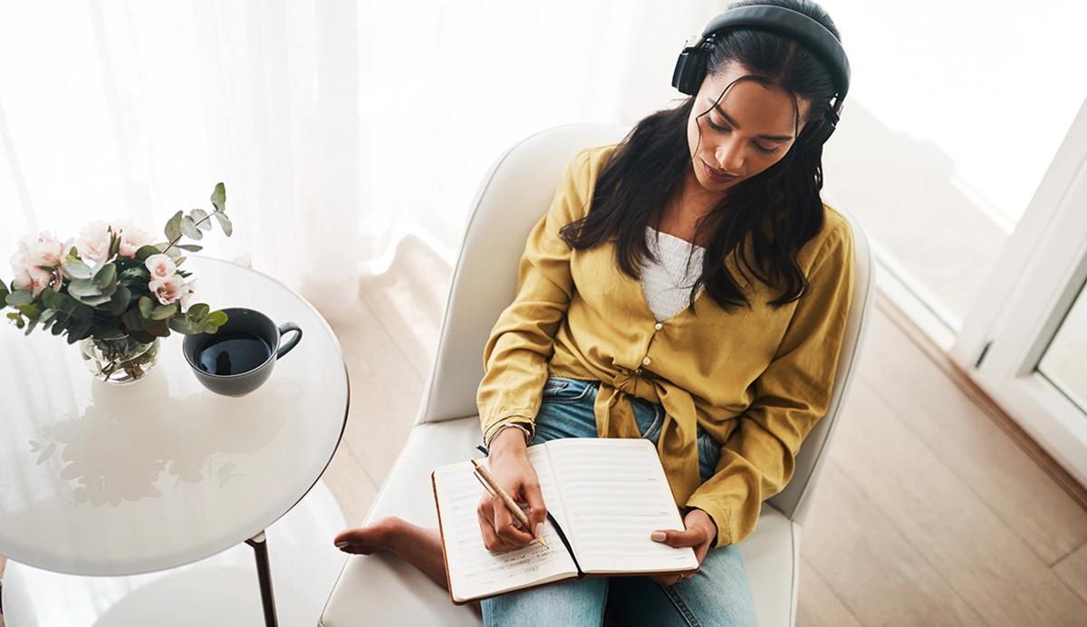 woman writing in a notebook